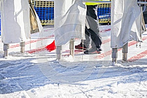 closing the entrance to the ski lift in the evening.