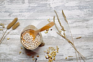 Cloth bag with chickpeas and spoon III photo