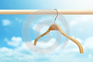 Cloth hanger in row blue sky