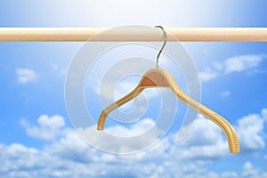 Cloth hanger in row blue sky