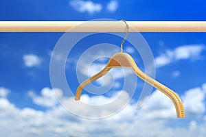 Cloth hanger in row blue sky