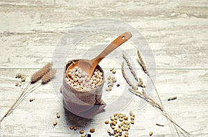 Cloth bag with chickpeas and spoon IV photo