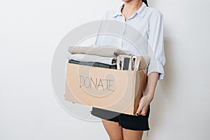 Clothes in box for concept donation and reuse recycle