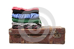Clothes on brown retro suitcase