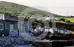 Clothes dry in the sun by a home photo