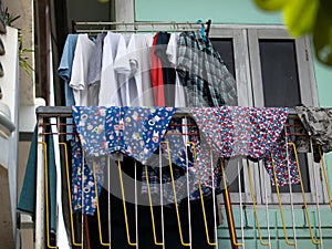 CLOTHES DRYING ON THE BALCONY