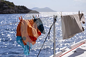 Clothes drying on a Catamaran deck