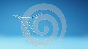 Clothes Drying Rack Spinning on Studio Blue Background