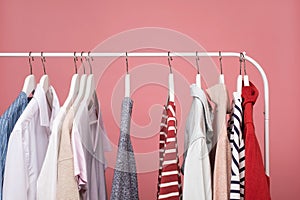 Clothes hang on a shelf in a clothes store