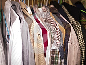 Clothes hang on a shelf photo