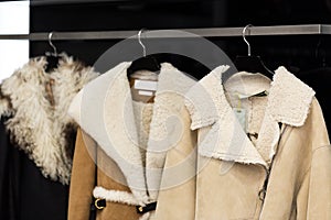 Clothes on a hanger in a modern designer boutique store