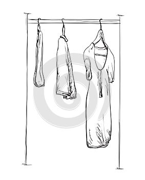 Clothes on hangers.