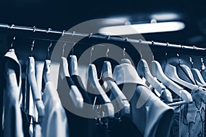 Clothes hangers in fashion store. Clothes business concept