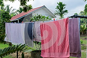 Clothes hangin in clothesline at sunny day