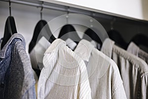 Clothes hanging in Closet Shop Fashion display photo