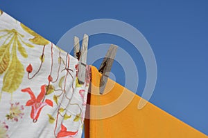 Clothes hanging from clothesline, drying in the sun