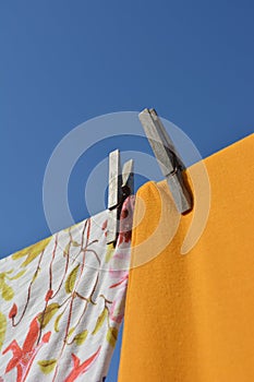 Clothes hanging from clothesline, drying in the sun