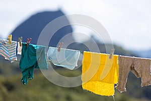 Clothes hanging with the Piedra el Penol in Guatape in background, Colombia photo