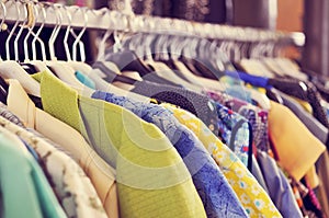 Clothes hanging on a rack in a flea market