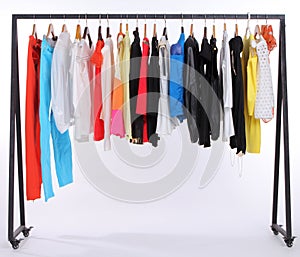 Clothes hanging on a shelf