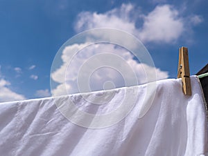 clothes hanging to be taken out after a day of laundry