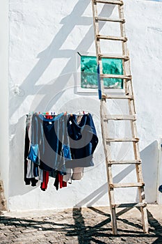 Clothes hanging to dry in front of house