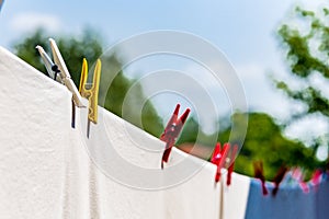 clothes hung out to dry with pegs