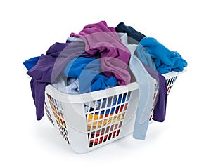 Clothes in laundry basket. Blue, indigo, purple. photo