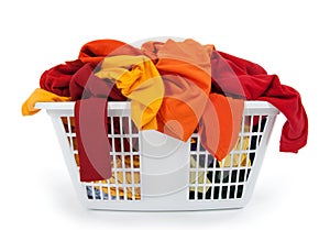 Clothes in laundry basket. Red, orange, yellow.