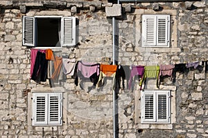 Clothes on the line between four windows