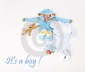 Clothes for a little baby boy on white background