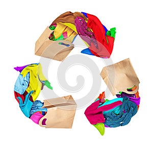 Clothes with paper bags folded in a recycling sign on a white background