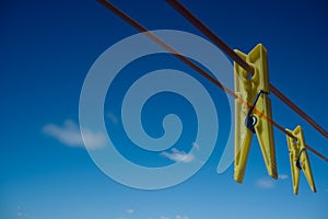 Clothes peg and blue sky background.