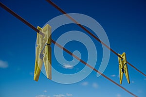 Clothes peg and blue sky background.