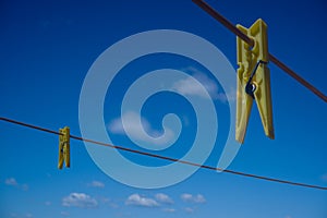 Clothes peg and blue sky background.