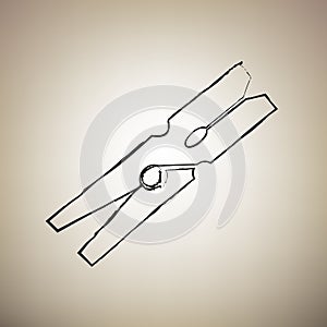 Clothes peg sign. Vector. Brush drawed black icon at light brown