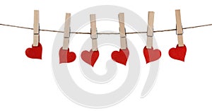 Clothes pegs and hearts on rope