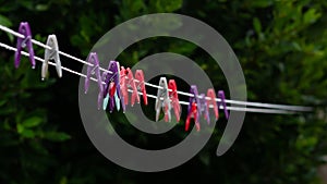 Clothes pegs on a line in the rain