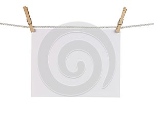 Clothes Pins Holding Paper photo