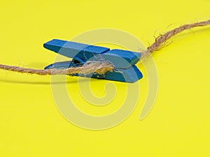 Clothes pins wooden on yellow background decorative