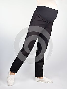 Clothes for pregnant, black pants with high waist isolated on white background