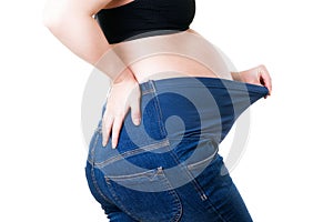 Clothes for pregnant women, blue jeans with high waist isolated on white background