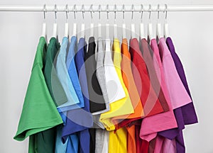 Clothes rack with colored tshirts photo