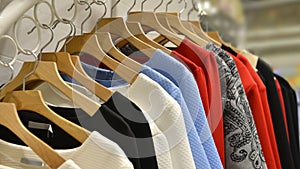 Clothes on racks in fashion shop,clothing store,clothes store,fashion shop photo