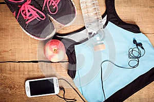 Clothes for running on wooden background