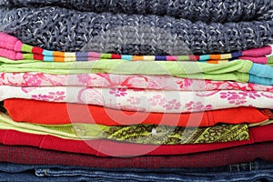 Clothes, shoes and accessories - group stack pile different clotes background