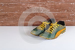 Clothes shoes and accessories - Old pair sneakers wooden background reflection