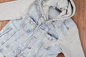 Clothes, shoes and accessories - top view blue jeans hooded jacket