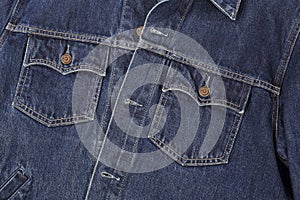 Clothes, shoes and accessories - top view fragment dark blue jeans jacket