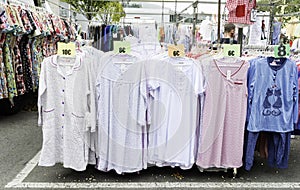 Clothes stand in a street market with a large sample of nightgowns